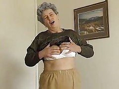 Hot granny Rosa takes her raiment off and reveals that saggy tits of hers. She squeezes them for greater amount fun and lays down on the bed. The excited old lady widens her legs and fingers her cunt a little. She has a dildo and is ready to play with it. Wanna watch her sucking and sticking it in her pussy?