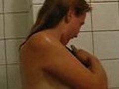 Girlie doesn't shy to be filmed on camera naked. This babe proceeds showering, when her guy enters bathroom.