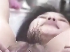 Korean wench with large snatch and pouty lips gets wicked on camera. She stuffs her hairy snatch with fingers, metal balls and even a bottle. This cunt can drink a lot of semen too!